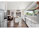 Spacious kitchen with a view into the living room, stainless steel appliances, and ample counter space at 7242 E Tyndall St, Mesa, AZ 85207