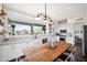 Lovely kitchen with island, stainless steel appliances, and a large window with a view at 7242 E Tyndall St, Mesa, AZ 85207