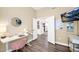 Bright office space with hardwood floors, modern desk, and stylish decor, perfect for a productive work-from-home environment at 7242 E Tyndall St, Mesa, AZ 85207