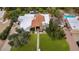 Aerial view of the property showcasing the home's layout, pool, and lush surroundings at 7250 E Paradise Dr, Scottsdale, AZ 85260