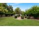 Secluded backyard with manicured lawn, desert landscaping and block fence for privacy at 7250 E Paradise Dr, Scottsdale, AZ 85260