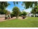 Secluded backyard with manicured lawn, desert landscaping and block fence for privacy at 7250 E Paradise Dr, Scottsdale, AZ 85260