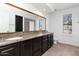Spacious bathroom featuring a double vanity, large mirror, and plenty of counter space and storage at 7250 E Paradise Dr, Scottsdale, AZ 85260