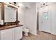Stylish bathroom features a vanity, toilet, walk-in shower, and direct access to the backyard at 7250 E Paradise Dr, Scottsdale, AZ 85260