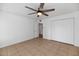 An open bedroom with a ceiling fan and closet will be the perfect space for a peaceful rest at 7250 E Paradise Dr, Scottsdale, AZ 85260
