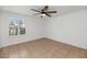 Simple, ready-to-decorate room with natural lighting and ceiling fan, perfect for customization at 7250 E Paradise Dr, Scottsdale, AZ 85260