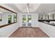 Breakfast nook with double doors that lead to a view of the backyard and pool at 7250 E Paradise Dr, Scottsdale, AZ 85260