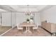 Formal dining room featuring chandelier, sideboard, and neutral finishes at 7250 E Paradise Dr, Scottsdale, AZ 85260