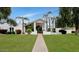 Charming home with well-maintained lawn, walkway, and mature landscaping at 7250 E Paradise Dr, Scottsdale, AZ 85260