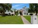 Beautifully landscaped front yard featuring mature trees and a welcoming walkway at 7250 E Paradise Dr, Scottsdale, AZ 85260
