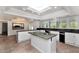 Bright kitchen with white cabinets, granite countertops, and stainless steel appliances at 7250 E Paradise Dr, Scottsdale, AZ 85260