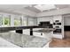 Well-equipped kitchen with granite countertops, stainless steel appliances, and island at 7250 E Paradise Dr, Scottsdale, AZ 85260