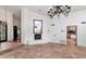 Open-concept living area showcasing tile flooring, a fireplace, and view to the kitchen at 7250 E Paradise Dr, Scottsdale, AZ 85260