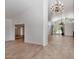 Open living space with tile flooring, high ceilings, and glass doors to the outdoor patio at 7250 E Paradise Dr, Scottsdale, AZ 85260