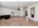 Spacious living room features tile flooring, fireplace, and decorative lighting at 7250 E Paradise Dr, Scottsdale, AZ 85260