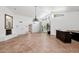 Bright living space with tile floors, tall ceilings, and sliding glass doors to the backyard at 7250 E Paradise Dr, Scottsdale, AZ 85260