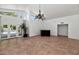 Bright living room with tile floors, high ceilings, and access to the backyard pool area at 7250 E Paradise Dr, Scottsdale, AZ 85260