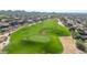 Expansive aerial view of well-maintained golf course, showcasing its manicured fairways and scenic surroundings at 7445 E Eagle Crest Dr # 1122, Mesa, AZ 85207