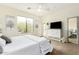 A bedroom featuring a large window, soft light, and decor that creates a serene atmosphere at 7445 E Eagle Crest Dr # 1122, Mesa, AZ 85207