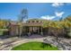 Beautiful clubhouse exterior with stone accents, manicured lawns, and serene landscaping at 7445 E Eagle Crest Dr # 1122, Mesa, AZ 85207