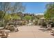 Community pool area featuring lush landscaping and a serene atmosphere for relaxation and leisure at 7445 E Eagle Crest Dr # 1122, Mesa, AZ 85207