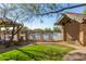 Community pool area showcasing lounge chairs, a pool house, and desert landscaping in a tranquil setting at 7445 E Eagle Crest Dr # 1122, Mesa, AZ 85207