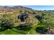 Lush backyard featuring mature trees surrounding beautiful home with expansive grassy area at 7445 E Eagle Crest Dr # 1122, Mesa, AZ 85207