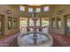 Elaborate water fountain within the clubhouse featuring stone columns and views of the landscaped grounds at 7445 E Eagle Crest Dr # 1122, Mesa, AZ 85207