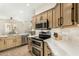 Kitchen featuring stainless steel appliances, double oven, and quartz countertops at 7445 E Eagle Crest Dr # 1122, Mesa, AZ 85207