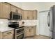 This kitchen boasts modern stainless steel appliances, sleek cabinets, and elegant countertops at 7445 E Eagle Crest Dr # 1122, Mesa, AZ 85207