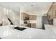 This kitchen features stainless steel appliances, quartz countertops and modern cabinets at 7445 E Eagle Crest Dr # 1122, Mesa, AZ 85207