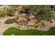 Artistic water feature with natural stone and lush greenery, creating a serene and picturesque landscape at 7445 E Eagle Crest Dr # 1122, Mesa, AZ 85207