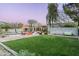 Expansive backyard with a pool, patio, and mature trees, perfect for outdoor living at 8644 E Sweetwater Ave, Scottsdale, AZ 85260