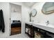 Clean bathroom showcasing double sinks, modern fixtures, and a neutral color scheme at 8644 E Sweetwater Ave, Scottsdale, AZ 85260