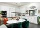 Bright, modern kitchen with white cabinetry, marble backsplash, and a cozy breakfast nook at 8644 E Sweetwater Ave, Scottsdale, AZ 85260