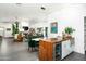 Open kitchen and living space with wood accents, modern appliances, and views of the living area at 8644 E Sweetwater Ave, Scottsdale, AZ 85260