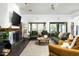 Inviting living room with fireplace, large windows, and stylish furnishings for a relaxing atmosphere at 8644 E Sweetwater Ave, Scottsdale, AZ 85260