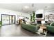 Open concept living room with fireplace, access to the pool area, and comfortable seating at 8644 E Sweetwater Ave, Scottsdale, AZ 85260
