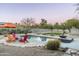 Backyard oasis featuring a sparkling pool, lounge chairs, and lush landscaping at 8644 E Sweetwater Ave, Scottsdale, AZ 85260