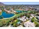 Breathtaking aerial perspective featuring a sparkling pool, tennis court and lush fairway views at 87 Biltmore Est, Phoenix, AZ 85016
