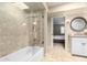 This bathroom features a tiled shower-tub combo, a vanity, and neutral decor at 87 Biltmore Est, Phoenix, AZ 85016