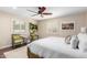 Relaxing bedroom with a ceiling fan, plantation shutters, and a comfortable, inviting atmosphere at 87 Biltmore Est, Phoenix, AZ 85016