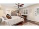 Tranquil bedroom with warm wood floors, plantation shutters, and tastefully arranged decor at 87 Biltmore Est, Phoenix, AZ 85016