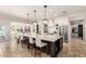 Bright kitchen with a marble countertop island, stainless steel appliances and breakfast nook with bay windows at 87 Biltmore Est, Phoenix, AZ 85016