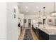 Bright kitchen with a large marble countertop island, stainless steel appliances, and plenty of cabinet space at 87 Biltmore Est, Phoenix, AZ 85016