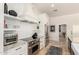 Close up on the kitchen area with stainless steel appliances, marble countertop, and ample cabinet space at 87 Biltmore Est, Phoenix, AZ 85016