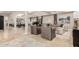 Spacious living room with tile flooring, coffered ceilings, and elegant furnishings at 87 Biltmore Est, Phoenix, AZ 85016