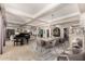 Open concept living and dining areas with modern furnishings and tile floors at 87 Biltmore Est, Phoenix, AZ 85016
