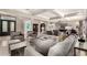 Spacious living room with coffered ceilings, ample seating, and natural light, ideal for entertaining and relaxing at 87 Biltmore Est, Phoenix, AZ 85016