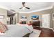 This main bedroom features a fireplace, ceiling fan, media center, and a separate desk/office space at 87 Biltmore Est, Phoenix, AZ 85016